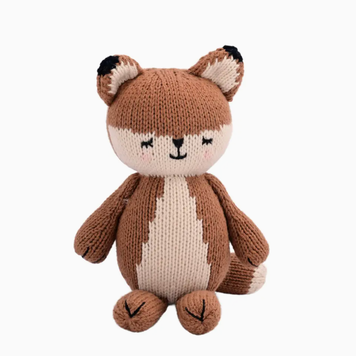 Knitted toy fox with a white belly on a white background