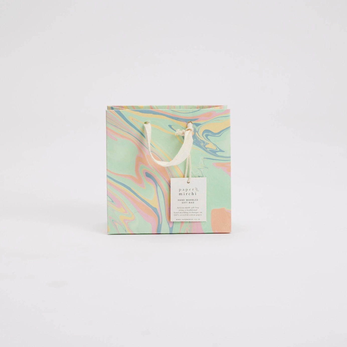 Marbled design product packaging with a tag on a white background