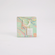 Marbled design product packaging with a tag on a white background