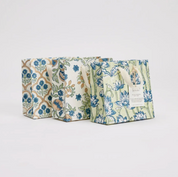 Three floral-patterned bags on a light gray background