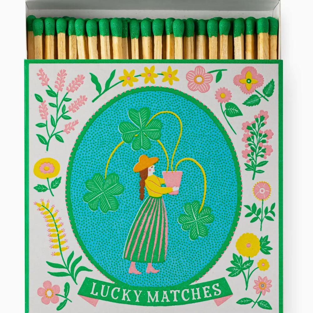 Matches with a decorative box featuring a woman and flowers, labeled 'Lucky Matches'.