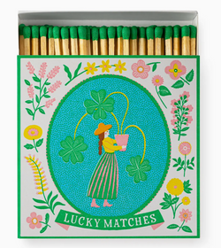 Matches with a decorative box featuring a woman and flowers, labeled 'Lucky Matches'.