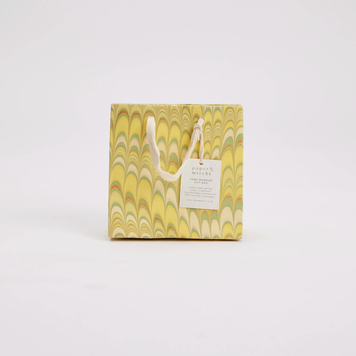 Gift bag with marbled design and handle on a white background