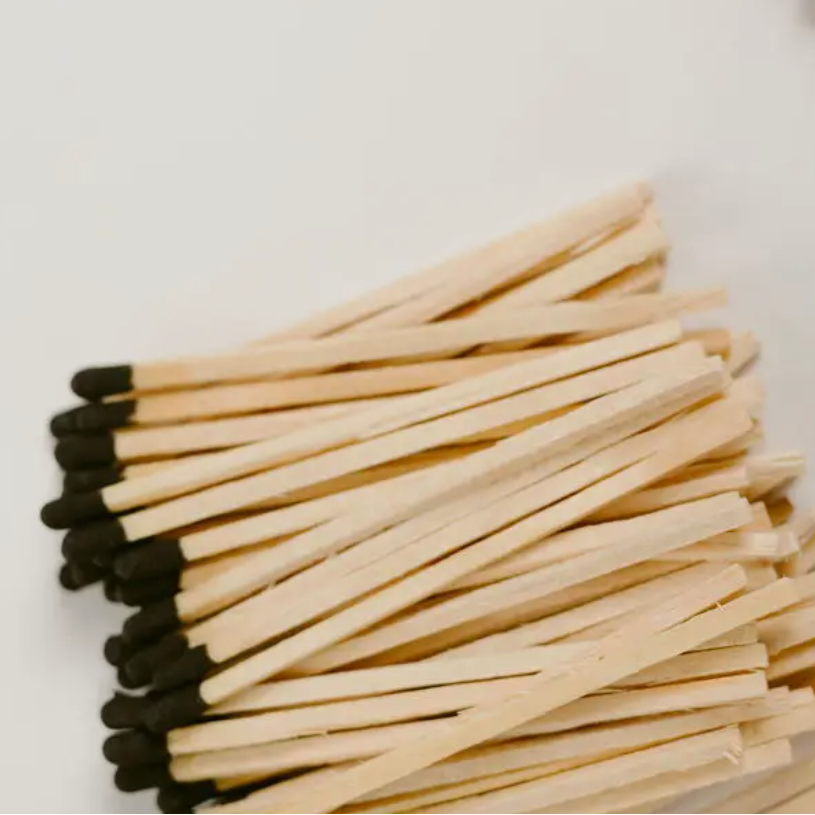 Matches with black tips on a white background