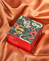 Snakes in the Garden Puzzle by Josefina Schargo - 100 Piece Puzzle